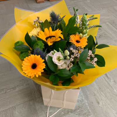 Sunrise - Energise their day with a stunning surprise. A warm collection of seasonal flowers artistically arranged by an artistic florist. Available for same day delivery when ordered before 2pm.