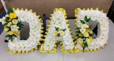 Funeral Tribute Dad - Dad, Yellow Ribbon Edge With Matching Sprays

Other Colours Available And Foliage Edge